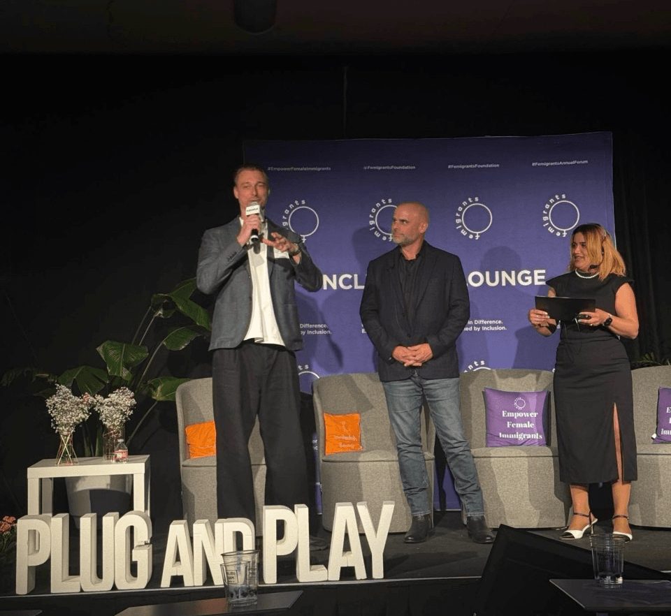 Yan on stage at Plug and Play